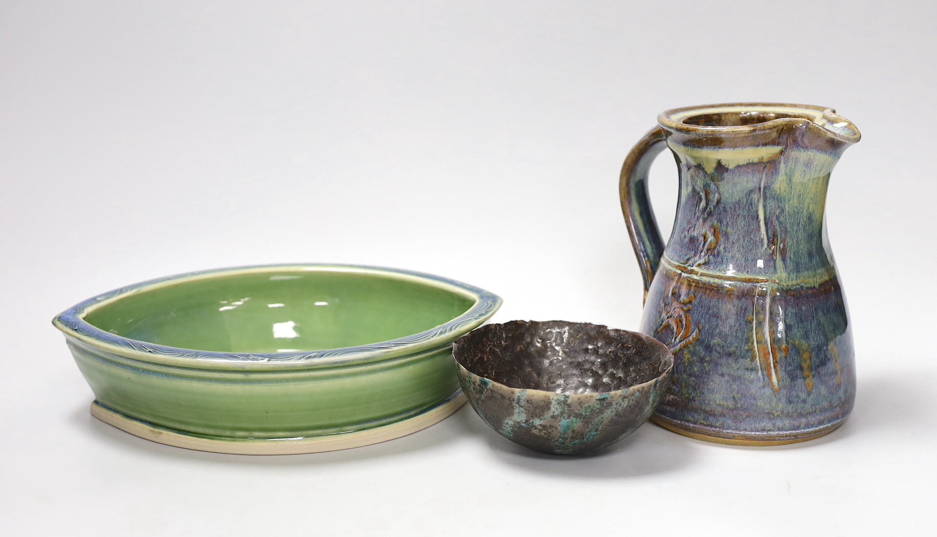 A Joe Finch (British b.1947) lustre jug, together with an Arwyn Jones eye shaped dish, and a Marcus Finch Raku bowl, tallest 16.5cm (3)